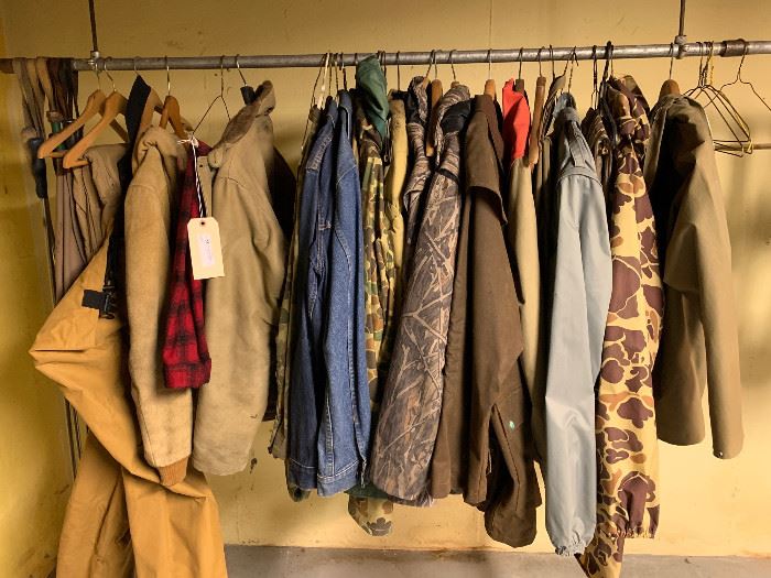 Lot of mens hunting clothes and a pair of waders