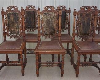 Set of antique chairs with cowhide seats and backs