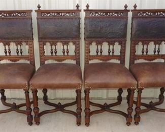 Set of four antique chairs with original leather backs. Has replacement leather seats