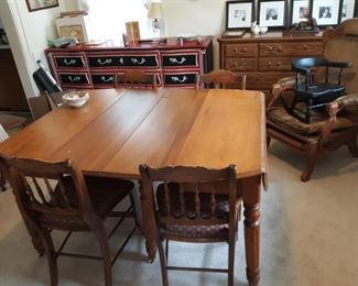 Antique drop leaf table with two extra leaves 6 chairs