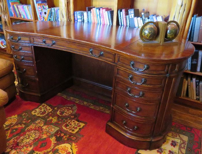 Oval executive desk