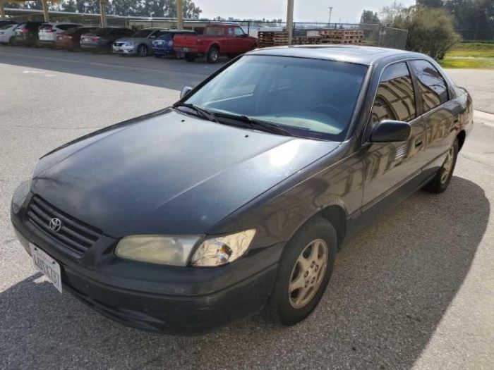 #133: 1999 Toyota Camry CURRENT SMOG!! SEE VIDEO!!
Cold A/C!

Estimated DMV Registration: $211 and $70 doc fees. CA title in hand.  

Year: 1999
Make: Toyota
Model: Camry
Vehicle Type: Passenger Car
Mileage: 295,342
Plate:
Body Type: 4 Door Sedan
Trim Level: CE; LE; XLE
Drive Line: FWD
Engine Type: L4, 2.2L; DOHC 16V; EFI
Fuel Type: Gasoline
Horsepower: 136HP
Transmission:
VIN #: JT2BG28K4X0295709

 