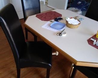Dining room table with four high back leather chairs
