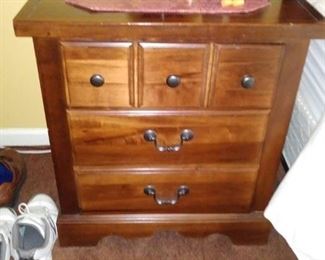 One of 2 three drawer nightstands