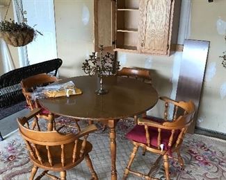 Like new oval table with two additional leaves and four matching barrel chairs
