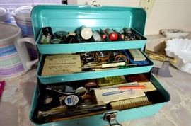 Vintage fishing box and watch repair items.
