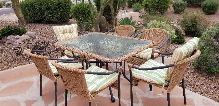 Patio set for sale has 6 chairs and glass table top.