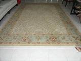 BEAUTIFUL 9 X 12 AREA RUG.. TAN AND LIGHT GREEN WITH A SPLASH OF CRANBERRY.. BOUGHT IN "RUGS AS ART".. GREAT SHAPE