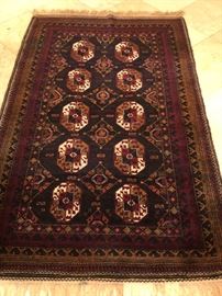 Afghan Baluchi hand-knotted wool rug.