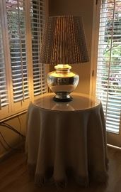 Mercury glass lamp on round accent table