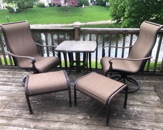 2 patio chairs with footstools and side table