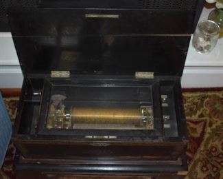 Antique Cylinder Music Box in Excellent Working Condition! The Cabinet contains a Pull Out Drawer which contains 2 more Cylinders!!! The sound is Absolutely Beautiful!!!
