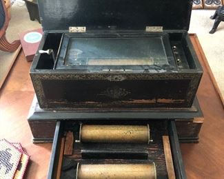 Antique Cylinder Music Box in Excellent Working Condition! The Cabinet contains a Pull Out Drawer which contains 2 more Cylinders!!! The sound is Absolutely Beautiful!!!
