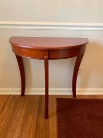 #18 1/2 round entry table 30x15x29 $75.00