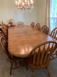 #23 oak dining table w double pedistal base w 2 leaves and 10 chairs -103x 43x29 $400.00