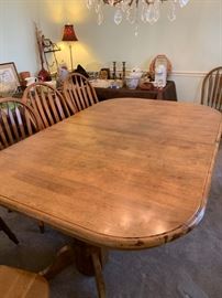 #23 oak dining table w double pedistal base w 2 leaves and 10 chairs -103x 43x29 $400.00