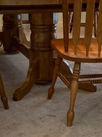 #23 oak dining table w double pedistal base w 2 leaves and 10 chairs -103x 43x29 $400.00