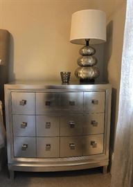 Gorgeous silver wooden chest it has 3 functional drawers. Silver seashell inspired lamp with round linen lamp shade is  a perfect accessory for it!