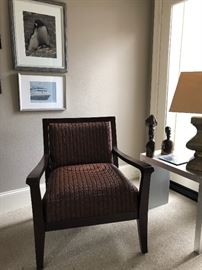 Side arm chair, maroon upholstry. African wooden decorative figurines.