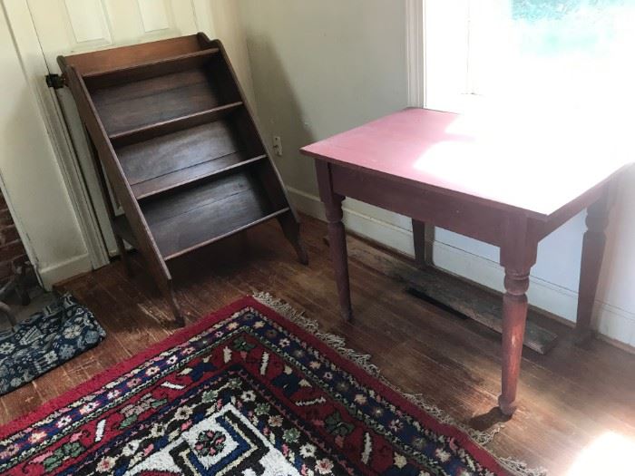 Interesting shelves and red painted table