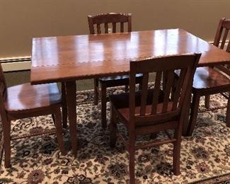 Small, solid kitchen table, perfect for a small space.