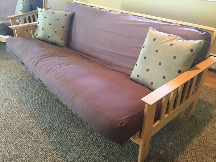 Pair of Maple futon frames 85x35x30 with taupe cushions with a purple cast 