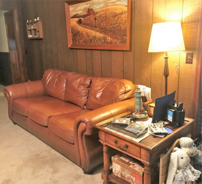 Leather sofa, rectangular side table, Framed art, floor lamp, bunnies