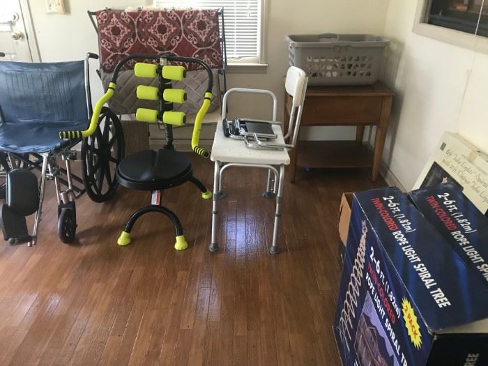 Wheel chair, other medical aids, small table, quilt, Christmas lights