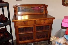 oak sideboard with glass doors and mirror back