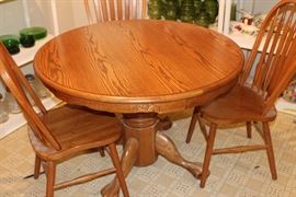 oak dining table and four chairs