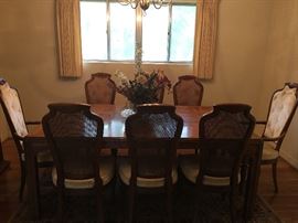 Stunning Mid Century Modern 
Burl Walnut Dining Room Table
by Drexel Heritage Furniture
8 Matching Cane Backed Drexel  
    High Back Chairs