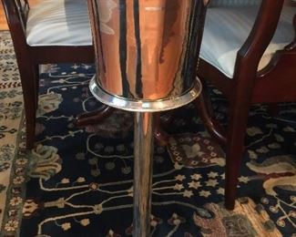 Silver ice bucket on a stand 