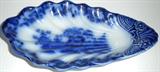 Flow blue dish (shell-shaped)