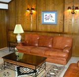leather sofa by Flexsteel; limited edition lithograph by Oklahoma Seminole artist Gary Montgomery; much more (den)