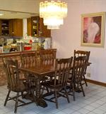 dark oak dining table with six chairs (two captain's chairs and two leaves included, but not pictured)