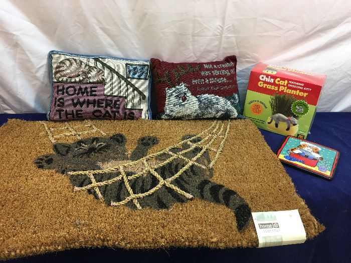 Cat door mat, Pillows, Chia planter and ceramic hot plate.