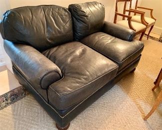 Vintage, hob nailed black leather love seat