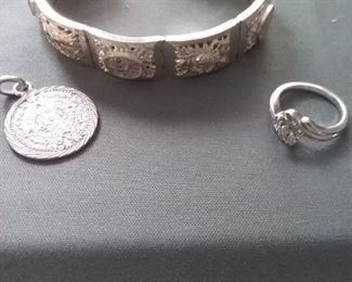 Silver Bracelet, Silver Medallion, and Silver Ring