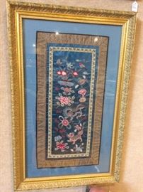 There are a number of framed Chinese silk embroidered panels.  