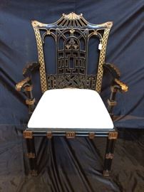 One of a pair of black & gold Asian arm chairs - elaborate finish