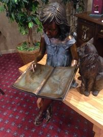 Darling solid cast bronze statue of a little girl reading to her cat 