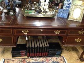 The desk has a leather embossed surface.