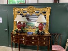 This extremely ornate mirror will add elegance to any room. 