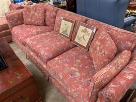 One of several sofas; red Asian chest used as a coffee table