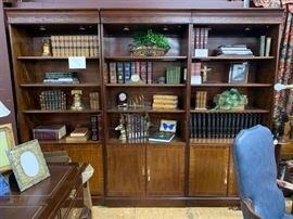 These 3  handsome bookcases  provide a large amount of display and storage areas.