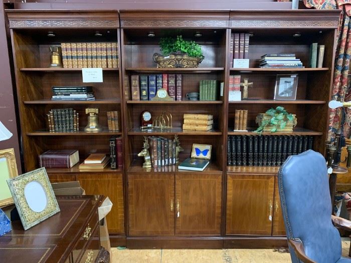 These 3  handsome bookcases  provide a large amount of display and storage areas.