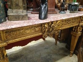 This exquisite marble-top table shouts sheer elegance! 