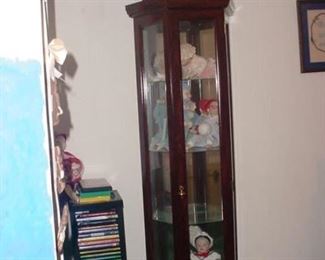 another curio full of dolls