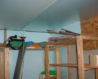 Old wooden shaft golf clubs and camping equipment
