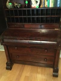 Bottom of the French secretary with the temple looking doors.